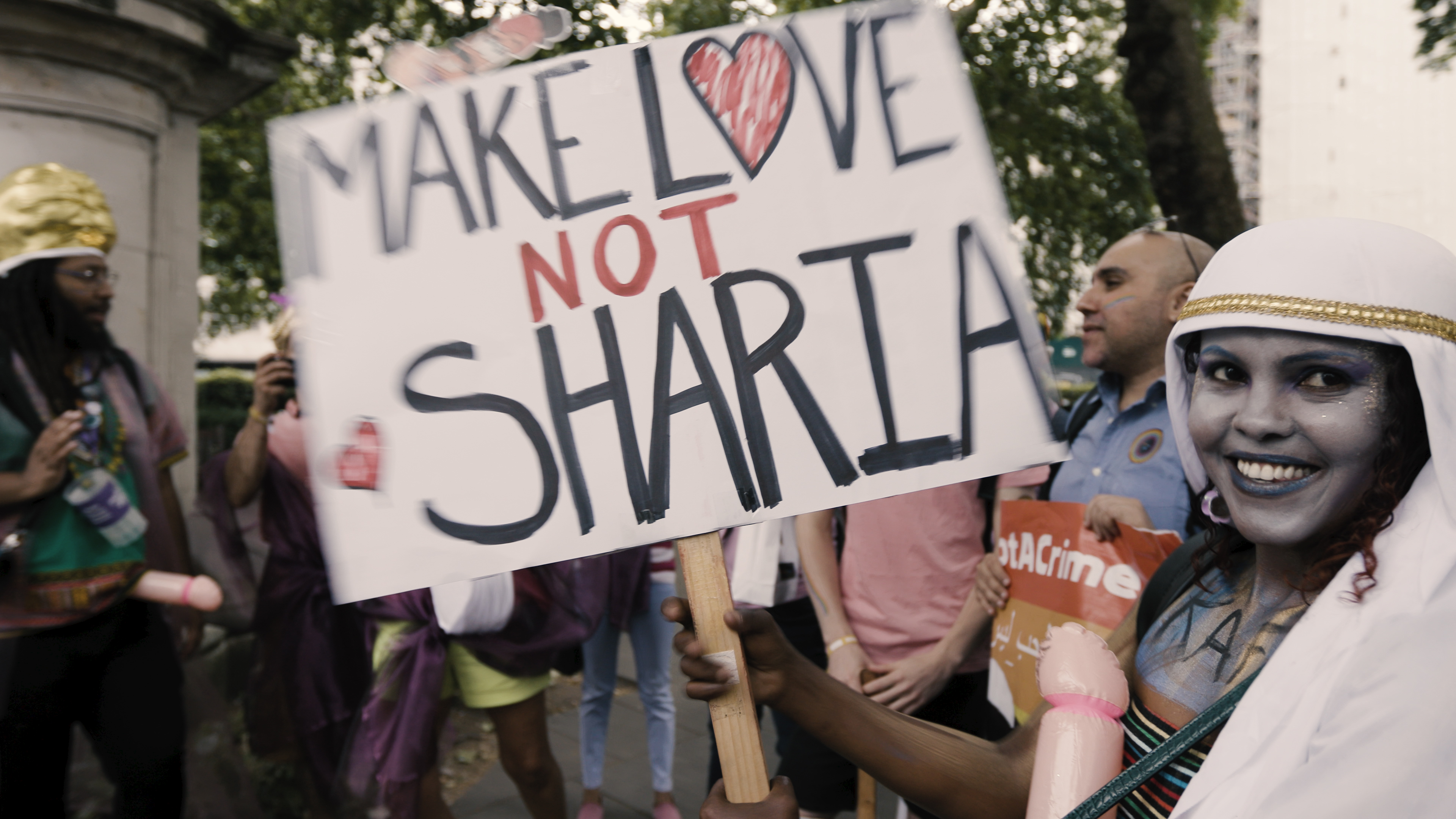 London Pride photo with banner make love not sharia
